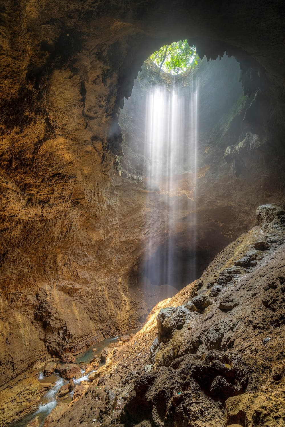 Sunlight falling down the shaft of Grubug Cave